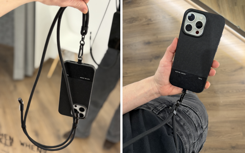 Жінка тримає iPhone у чохлі Native Union на чорному кросбоді-ремінці Satechi On-the-Go.